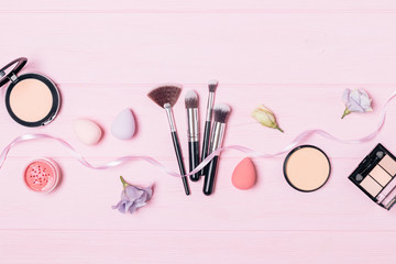 Flat lay makeup products and brushes