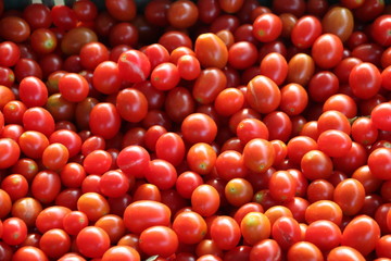 Delicious red tomatoes. Summer tray market agriculture farm full of organic vegetables It can be used as background.