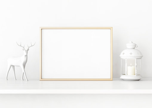 Horisontal christmas poster mockup with golden frame, deer and candle lantern on white wall background. 3D rendering, illustration.