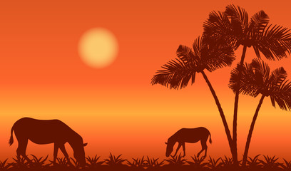 Fototapeta na wymiar Africa landscape with zebras silhouettes and palm trees