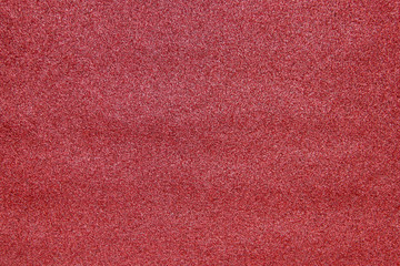 A texture of a medium grit sandpaper