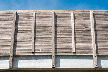 Detailed, architectural view of a newly constructed, mostly timber walkway. Showing detail of the timber design and batons that make up the overall frame.