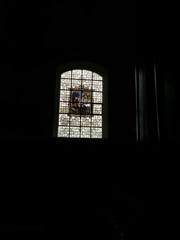 Bruges (Belgium). April 2016.  Beginage. The monastery church. Stained glass window.