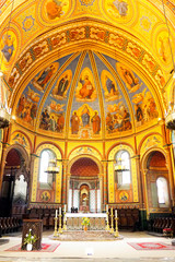 Fototapeta na wymiar nave of gold and turquoise of the Saint Caprais Cathedral, in Agen, the world capital of dried prunes, in Occitania, in the south-west of France - Free entrance