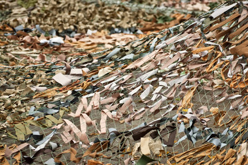 Handmade camouflage mesh. The world's longest camouflage made from rags and cloth pieces. The grid is made by civilians in support of peace. Voluntary action to end the war.