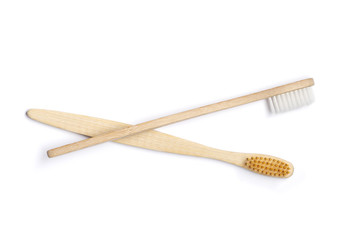 Two Bamboo toothbrushes on white background. Dental care