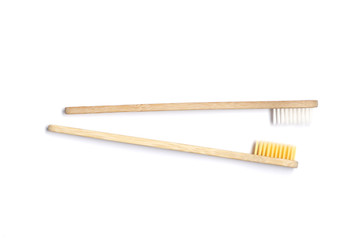 Two Bamboo toothbrushes on white background. Dental care