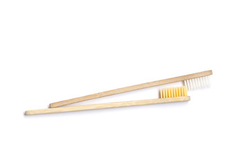 Two Bamboo toothbrushes on white background. Dental care