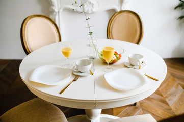 Table served for breakfast in living room, close up view