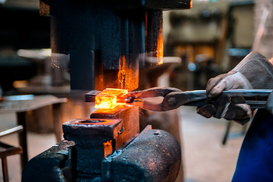 Blacksmith forging hatchet