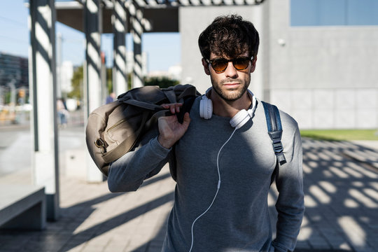 Cool Man Holding Travelling Bag In The City