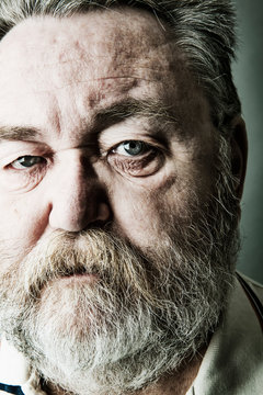 Portrait of senior man with full beard, close-up
