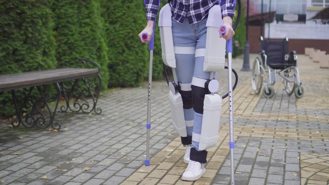 walking in the robotic exoskeleton outdoor close up