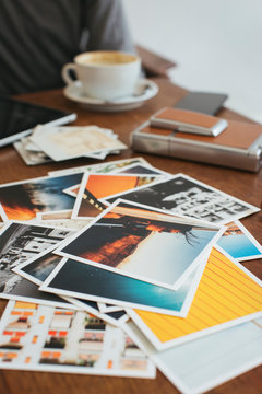 Photo prints on wooden table