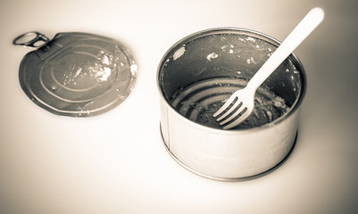 used tin can on grunge background