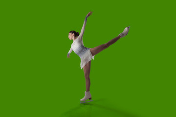 Figure skating girl isolated on green background.