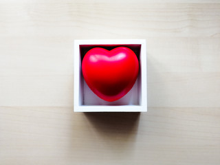 Red heart inside a white box 