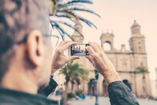 Spain, Canary Islands, Gran Canaria, Las Palmas, man taking picture of Catedral de Santa Ana