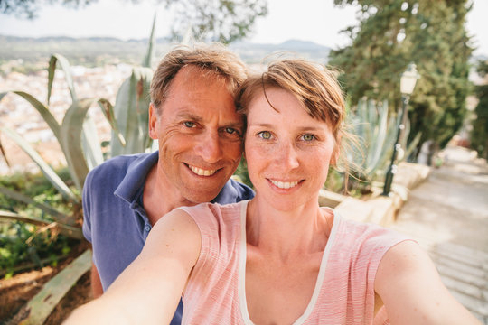 Spain, Mallorca, Arta, portrait of couple taking a selfie
