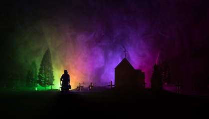 Fototapeta premium Diffuse entities walking on a street from an old European cemetery in moonlit night