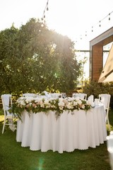 White table setting at wedding reception.