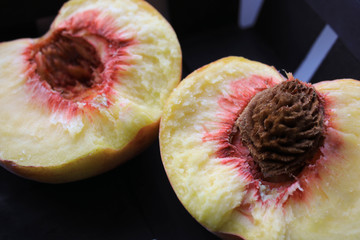 The peach is cut in half