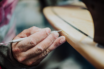 A local surf shaper from Tenerife working on a new surfboard