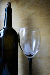 Bottle of wine, glass and grapes