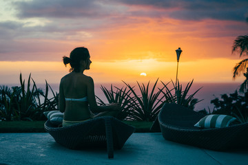 Woman doing sunset yoga session in Hawaii
