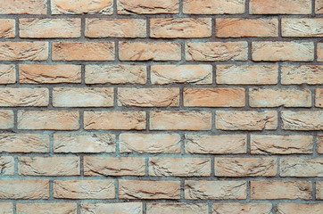 Light colored beige brick wall texture background 