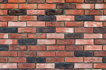 Fototapeta premium Multicolored motley brick wall texture background 