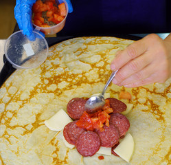 Pancake on frying pan view from above in a cafe