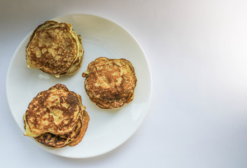 Pancakes on a white plate