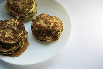 Pancakes on a white plate