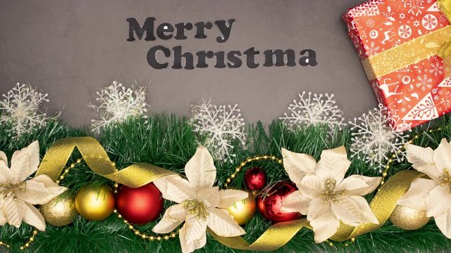 Merry Christmas title appear above Christmas decoration with  gold and red ornaments - Stop motion animation 