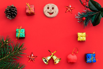 Creative Composition Useful for Christmas and New Year Greeting Card Created Using Gift Boxes, Christmas Bell, Pine Branch, Cookie Smiley, Red Stars and Empty Space For Copy