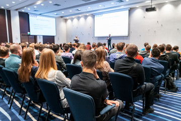 Image of a conference that takes place in a large conference room, workshop for young professionals, training in a large conference room, adult training - obrazy, fototapety, plakaty
