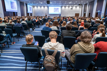 Image of a conference that takes place in a large conference room, workshop for young...