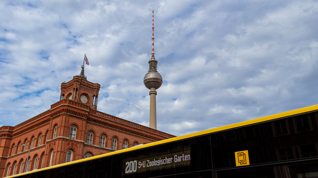The famous Red Town Hall, the Berlin TV Tower and part of a typical Berlin bus