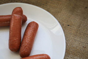 Sausages on a white plate