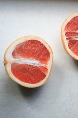 Sliced grapefruits on a stone table