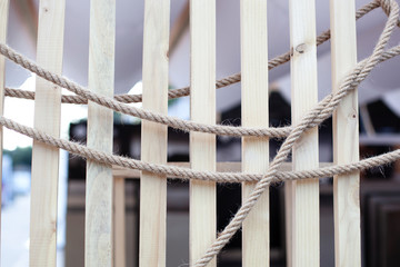 Abstract background close up Arranging rope on wood texture boards. brown nautical knotted rope on...