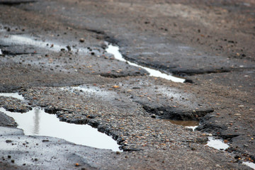 large pits with asphalt, macro.