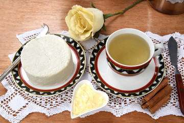 cup of tea with cheese on wooden table, brazilian breakfast