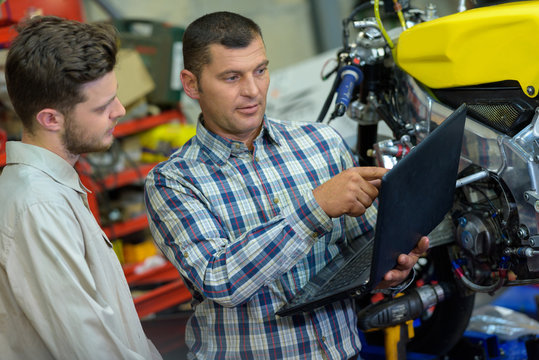 two men talking about motorbikes