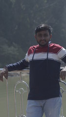 man standing near lake