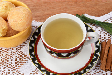 cup of tea with cheese on wooden table, brazilian breakfast
