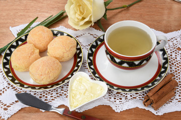 cup of tea with cheese on wooden table, brazilian breakfast