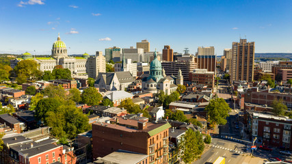 Afternoon light hits the buildings and downtown city center area in Pennsylvania state capital at...