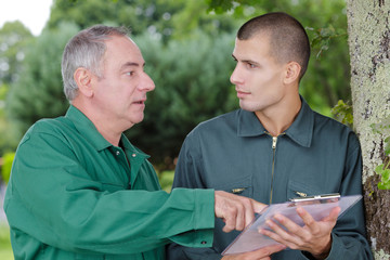 two agricultural engineers analyze data